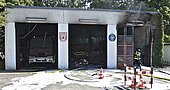 Durch Brand zerstörte Fahrzeughalle